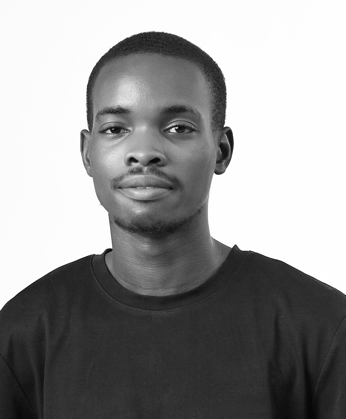 Black and white portrait of ADEKUNLE ADEKUNMISI as part of the Oshinowo Studio team picture