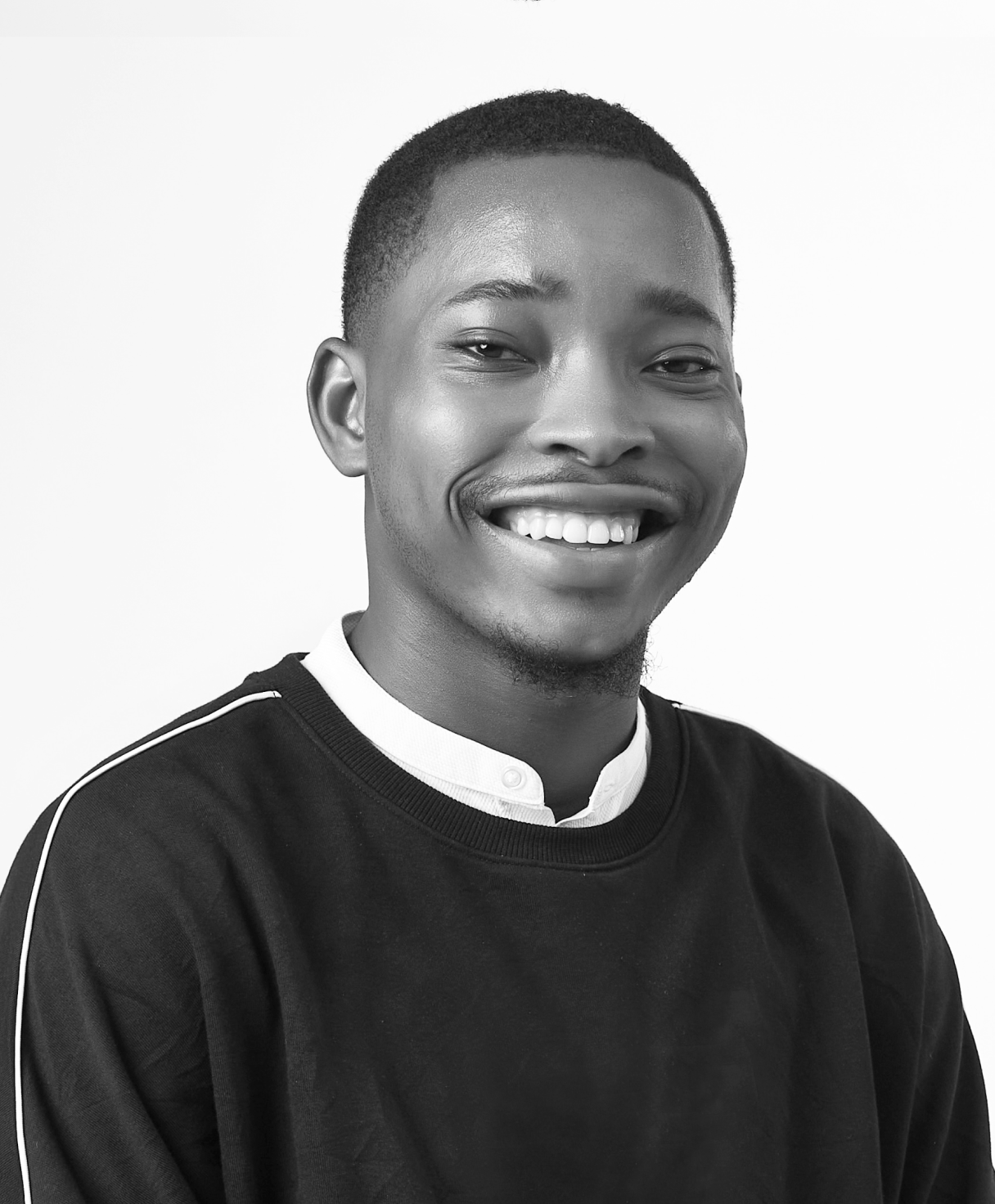 Black and white portrait of BASHIR KAREEM as part of the Oshinowo Studio team picture