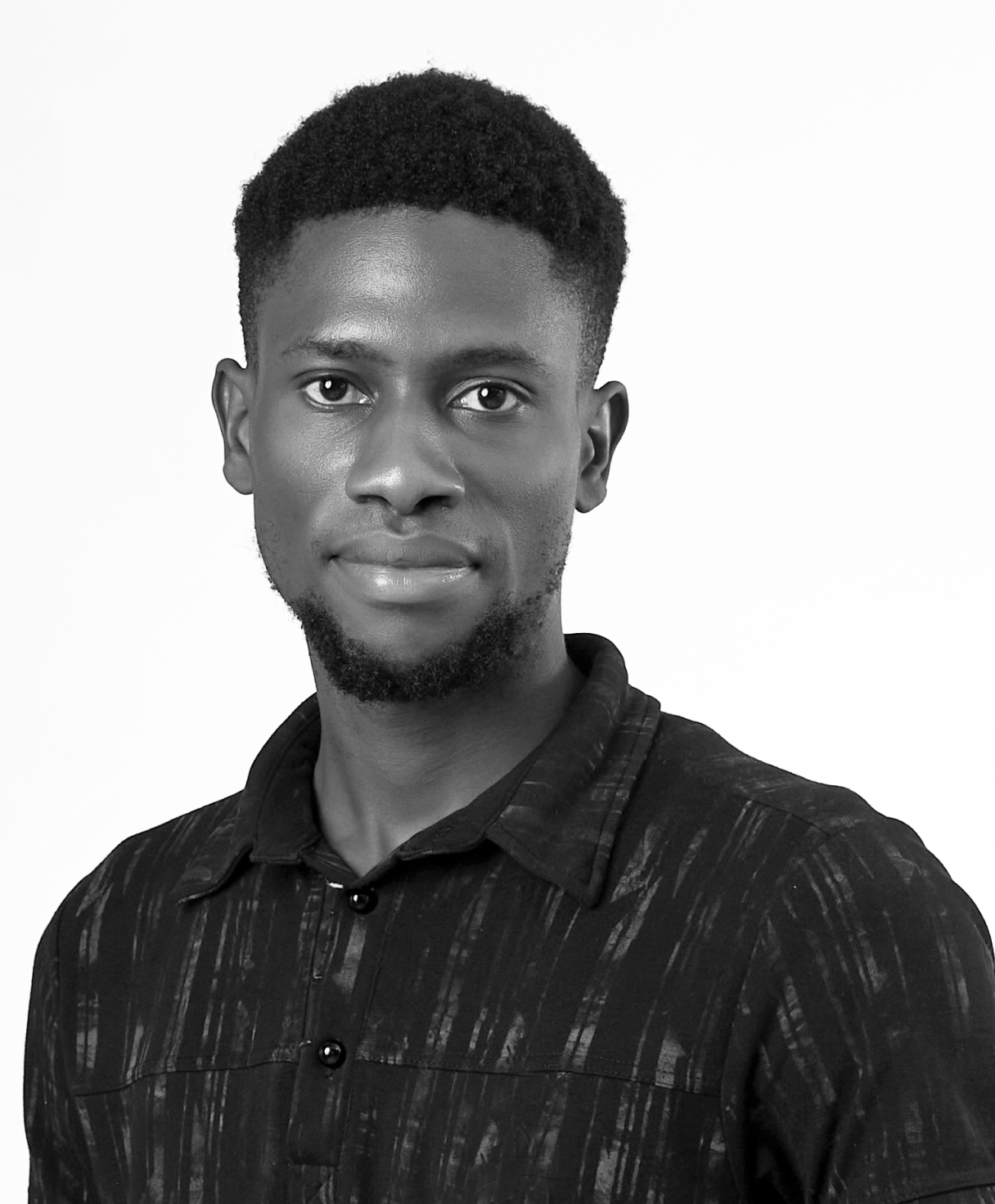 Black and white portrait of CALEB IWAYEMI as part of the Oshinowo Studio team picture