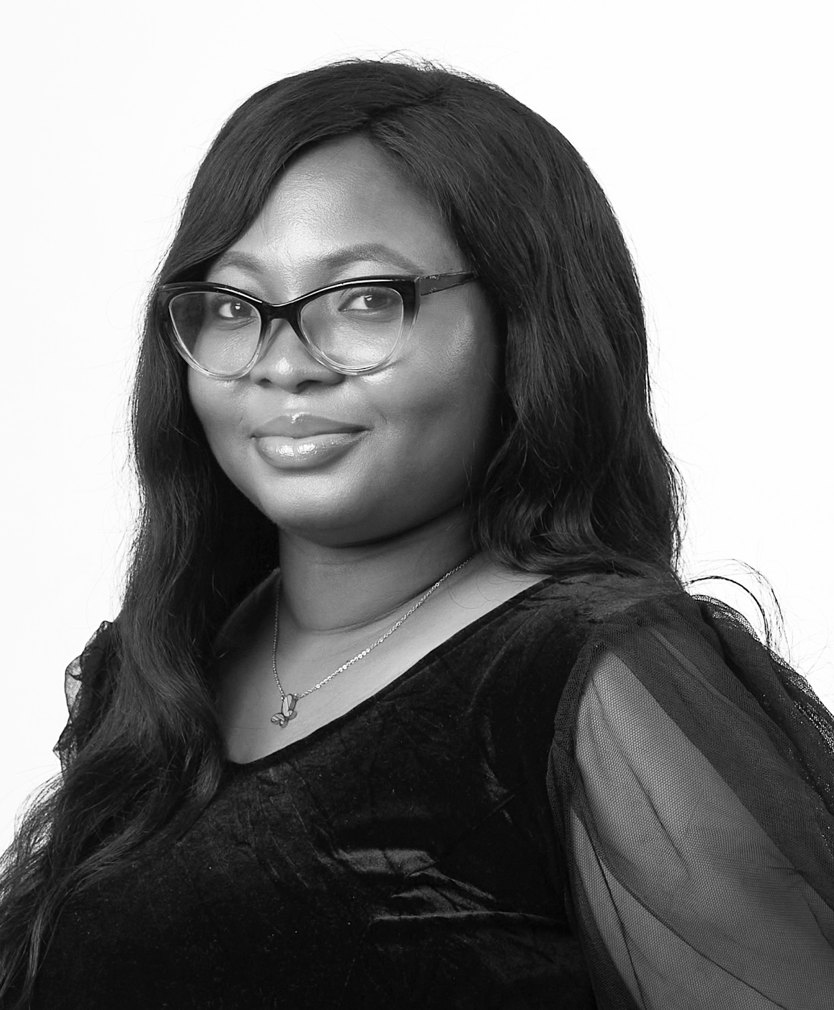 Black and white portrait of FOLASHADE WILLIAMS as part of the Oshinowo Studio team picture