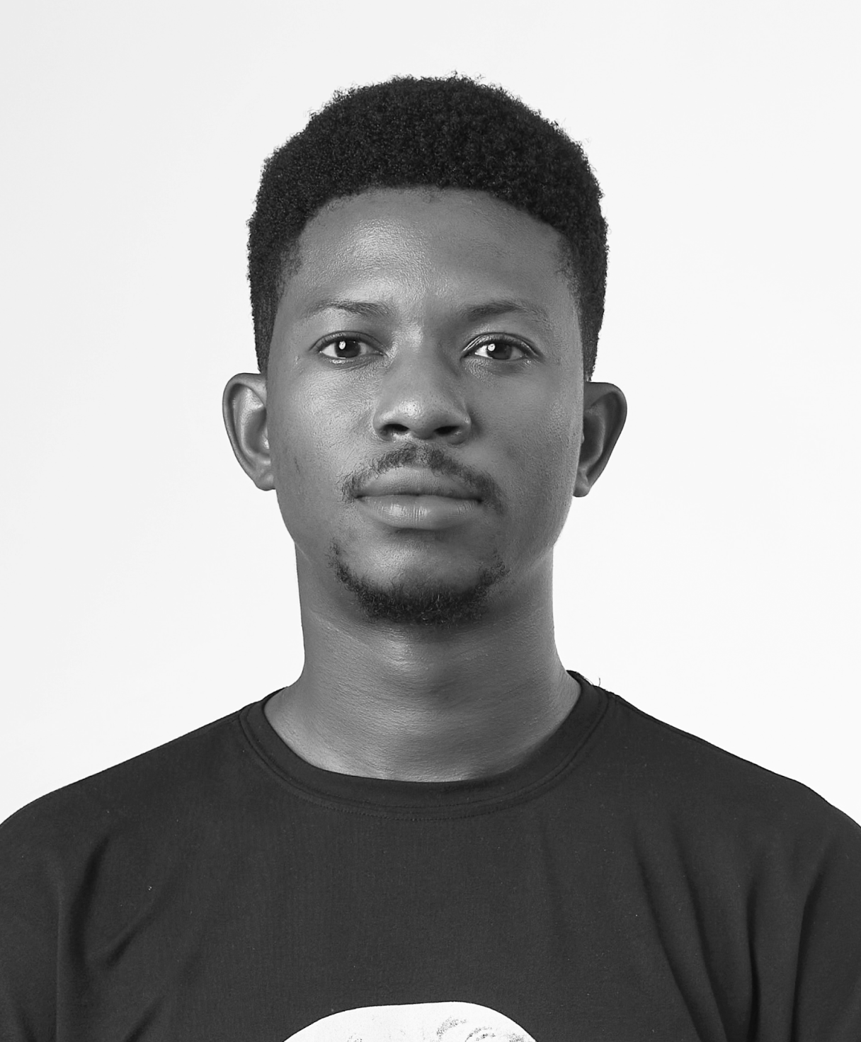 Black and white portrait of NNAMDI OPARA as part of the Oshinowo Studio team picture
