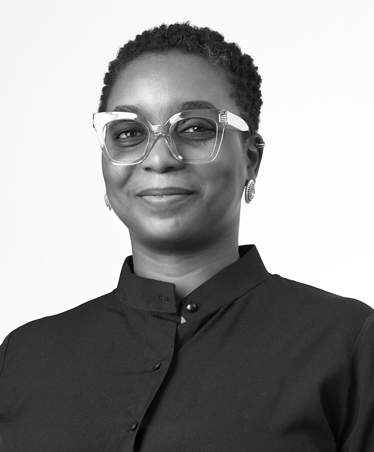 Black and white portrait of OBIAMAKA OFODILE as part of the Oshinowo Studio team picture